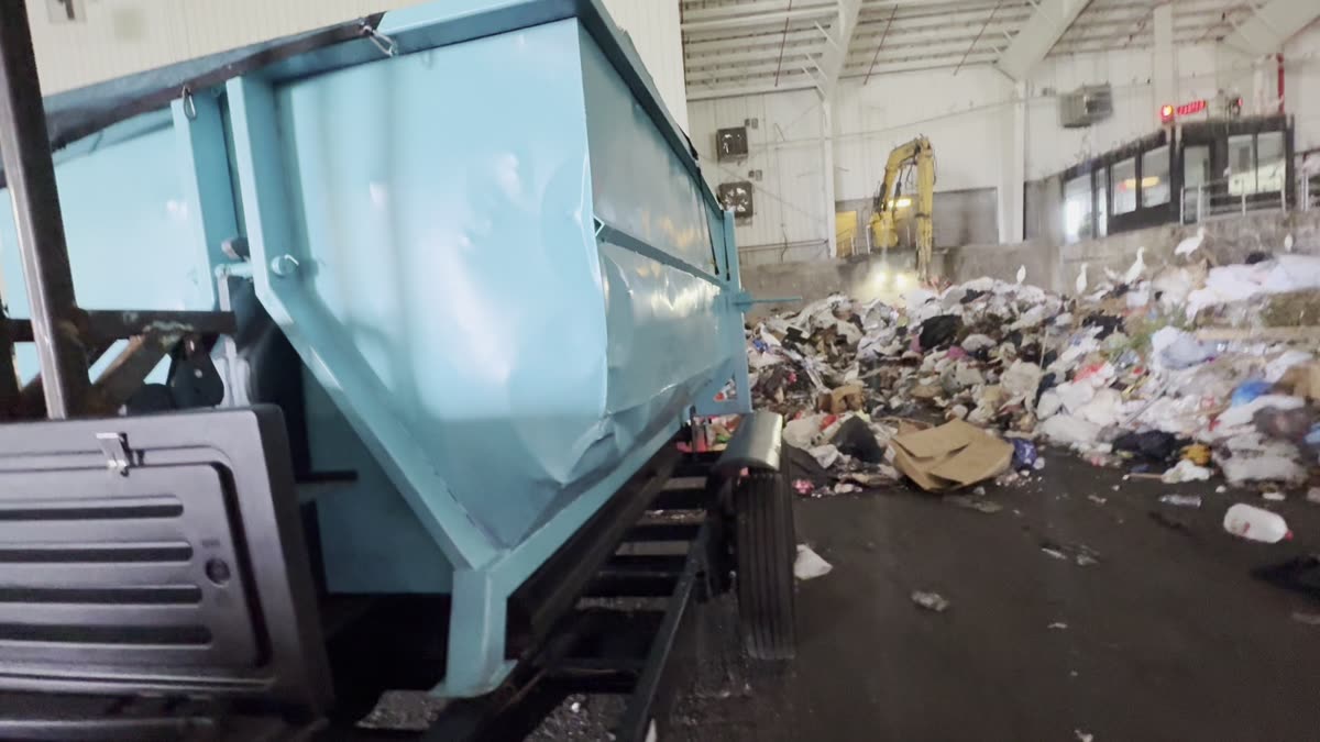 BayCo container tipping debris at the transfer station